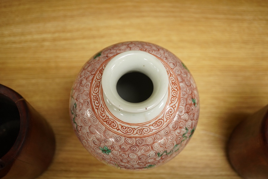 A Chinese famille rose jardiniere and bamboo oak rail, famille rose jardiniere 27cm diameter. Condition - jardiniere cracked from rim and restored, bamboo side cracked